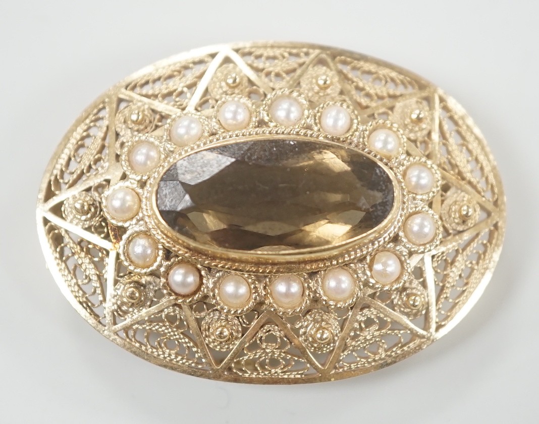 A 14k, oval cut citrine and split pearl cluster set oval brooch, 43mm, gross weight 17.8 grams.